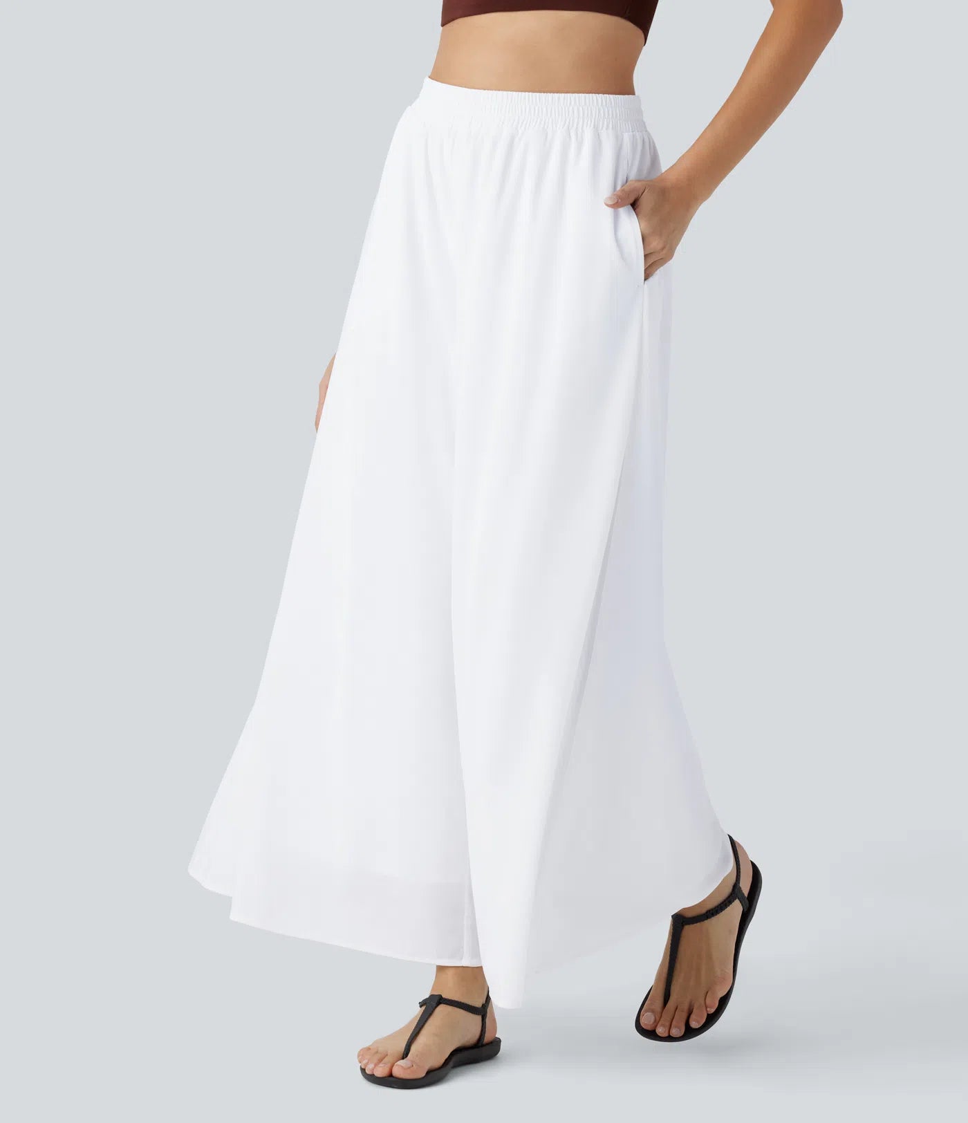 Pantalones relajados de talle alto, con bolsillos y sobreposición de malla, de pierna ancha