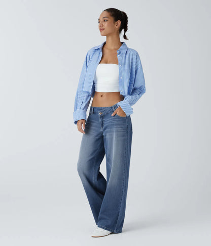 Jeans anchos de cintura baja, bolsillos con cremallera asimétricos, acabado lavado
