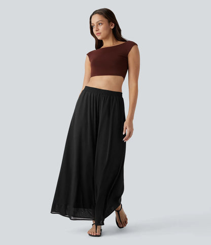 Pantalones relajados de talle alto, con bolsillos y sobreposición de malla, de pierna ancha