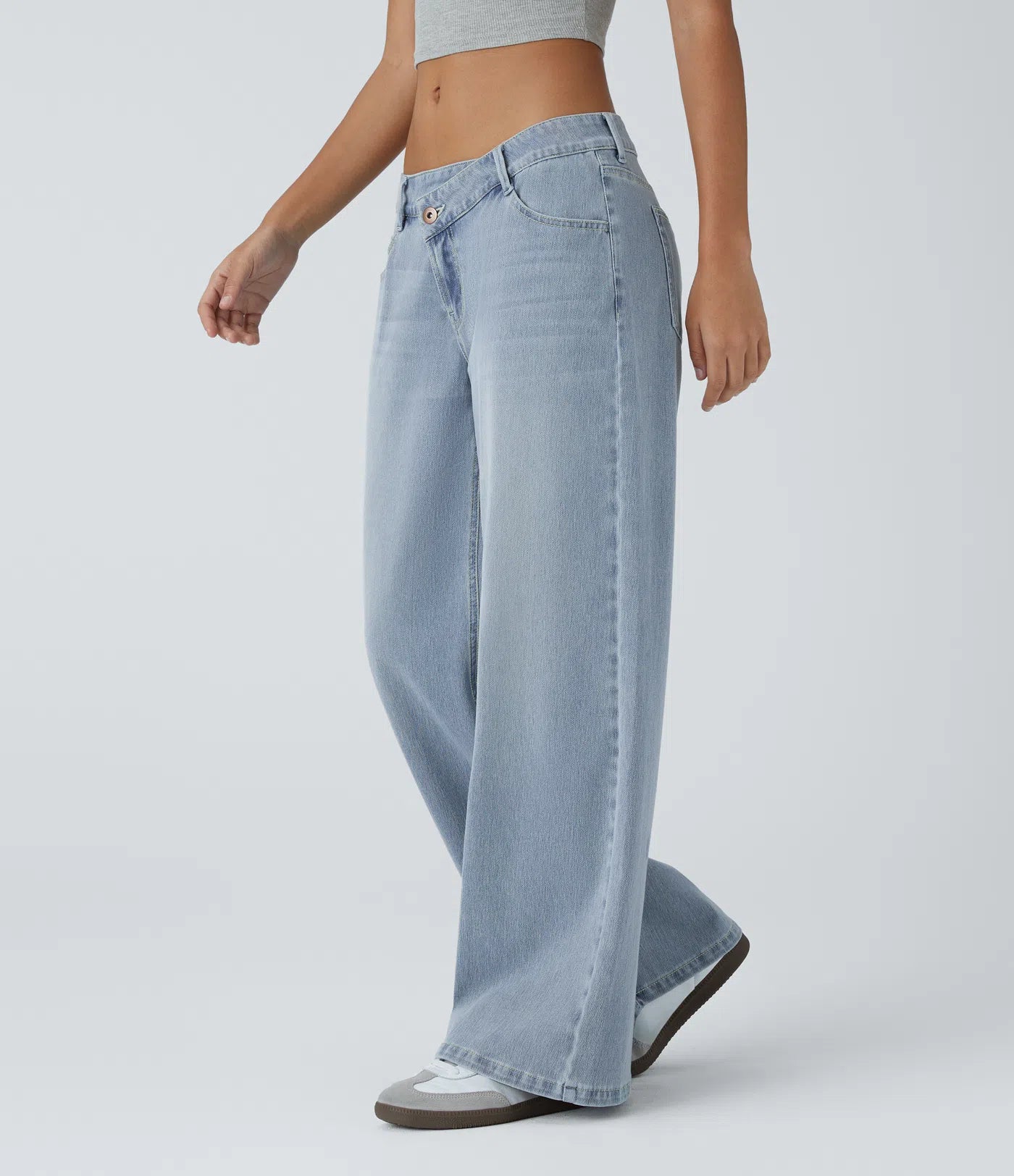Jeans anchos de cintura baja, bolsillos con cremallera asimétricos, acabado lavado
