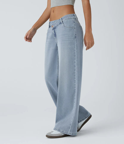 Jeans anchos de cintura baja, bolsillos con cremallera asimétricos, acabado lavado