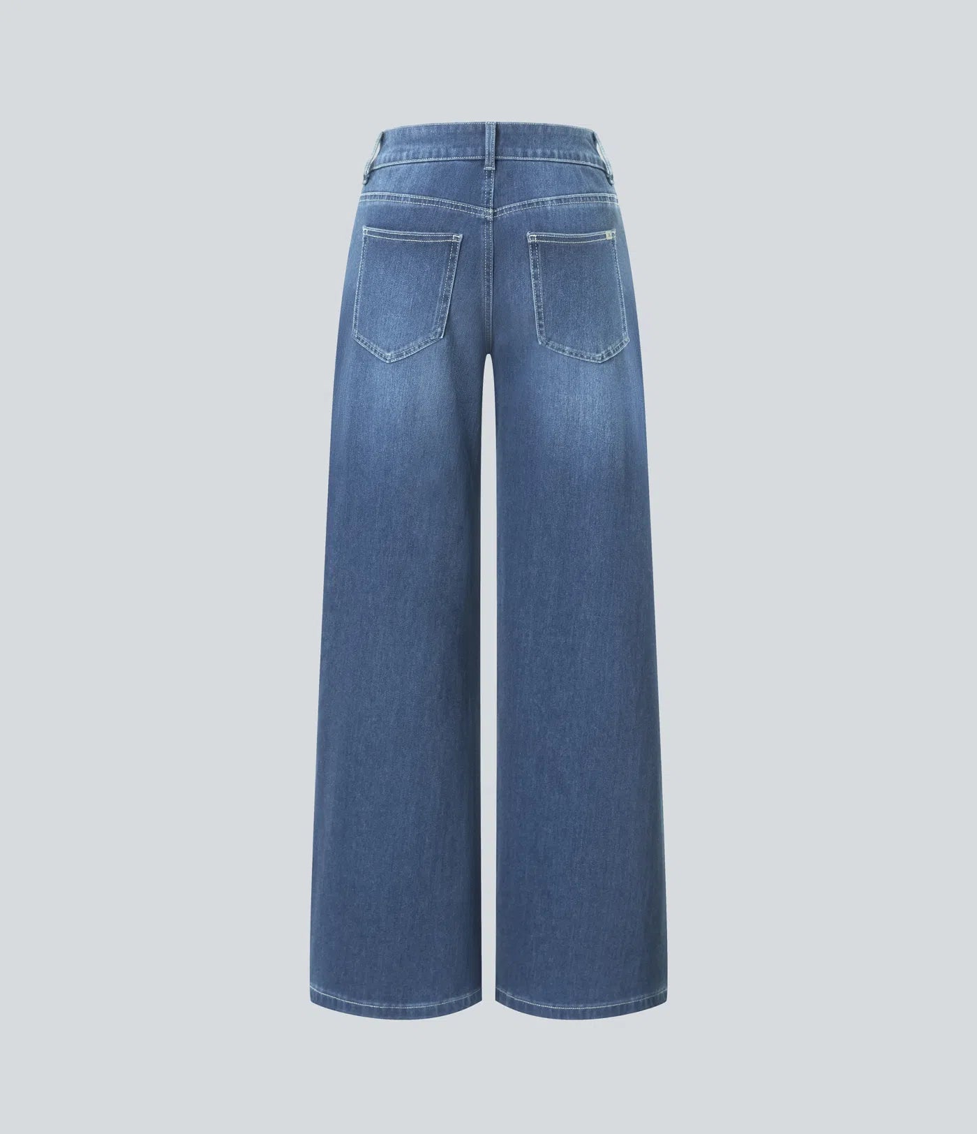 Jeans anchos de cintura baja, bolsillos con cremallera asimétricos, acabado lavado