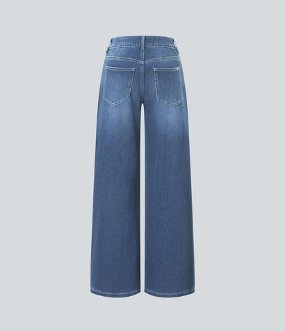 Jeans anchos de cintura baja, bolsillos con cremallera asimétricos, acabado lavado