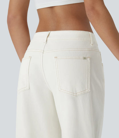 Jeans anchos de cintura baja, bolsillos con cremallera asimétricos, acabado lavado