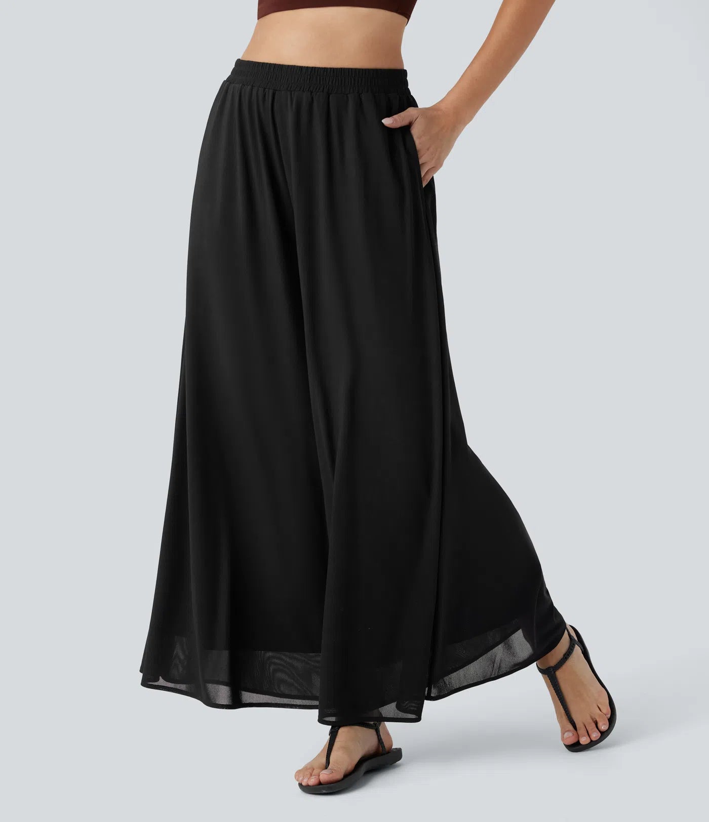 Pantalones relajados de talle alto, con bolsillos y sobreposición de malla, de pierna ancha