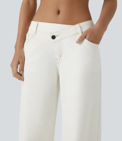 Jeans anchos de cintura baja, bolsillos con cremallera asimétricos, acabado lavado