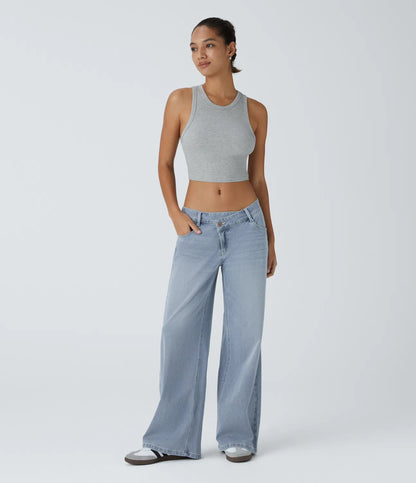 Jeans anchos de cintura baja, bolsillos con cremallera asimétricos, acabado lavado