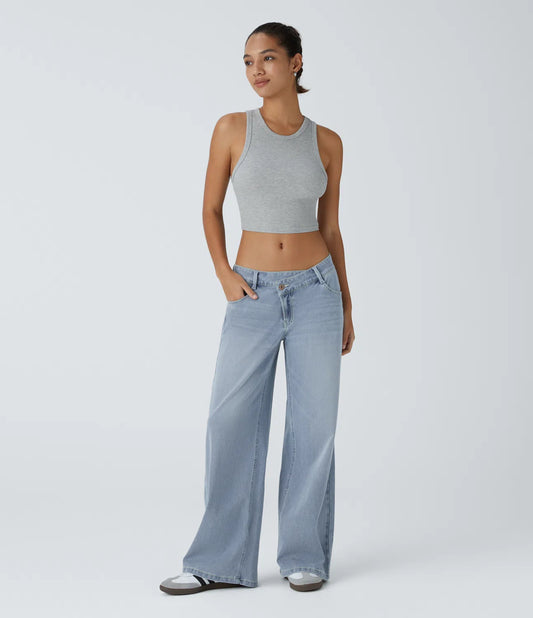 Jeans anchos de cintura baja, bolsillos con cremallera asimétricos, acabado lavado